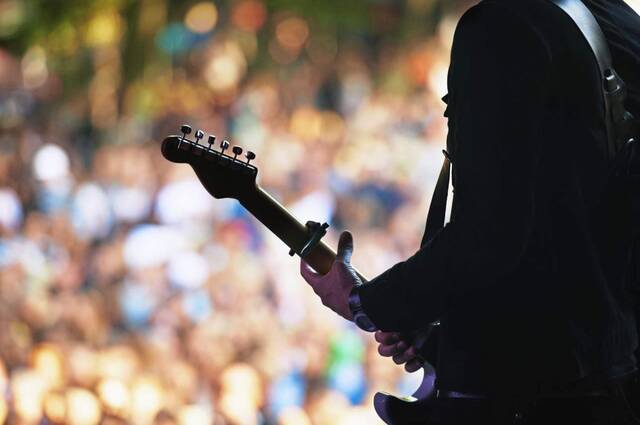 8626116_web1_Guitar-on-stage