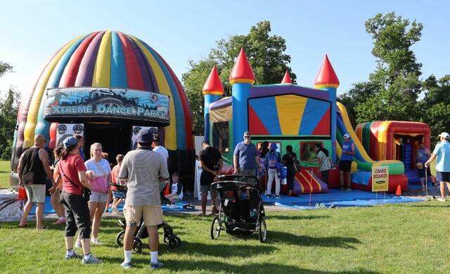 8629966_web1_community-day-inflatables-2