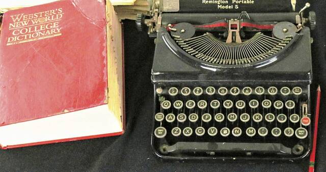 8737726_web1_WEB-typewriter-and-dictionary
