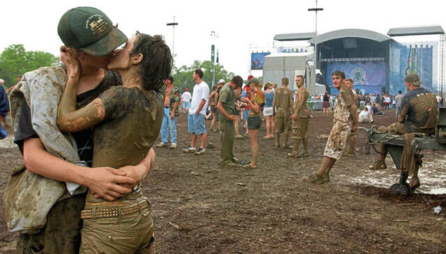 
			
				                                Josh Tamburo, 16, and Emily Cross, 14, both of North Hills, during the Rolling Rock Town Fair at the Westmoreland Fairgrounds on July 31, 2004.

			
		
