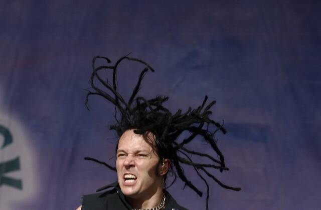 
			
				                                John Moyer, the bassist for Disturbed, performs during the Rolling Rock Town Fair at the Westmoreland Fairgrounds on July 31, 2004.

			
		