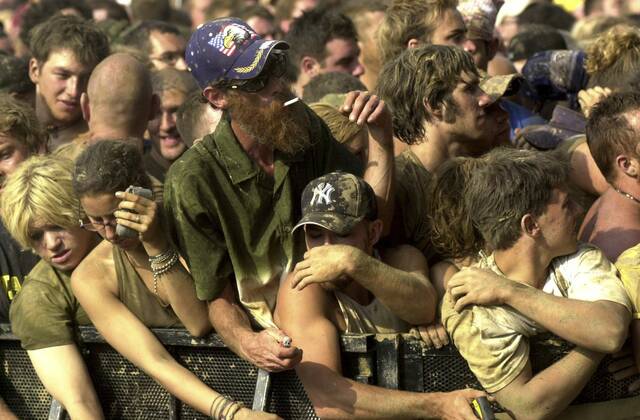 
			
				                                The crowd waits for Outkast to perform at the Rolling Rock Town Fair on July 27, 2002. 

			
		