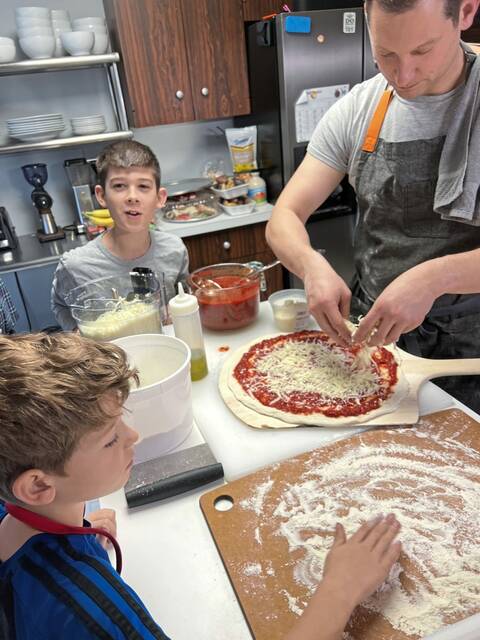 8741803_web1_her-pizzasurgeon-081425-7