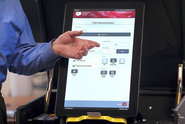 8742407_web1_votingmachine