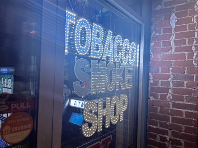 8869359_web1_PTR-Smoke-shop-sign-Pittsburgh-South-Side-at-night-2025