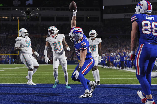 Bills tight end Jackson Hawes celebrates after scoring against the Dolphins during the first half Thursday.