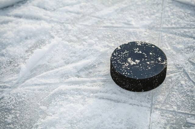 8892598_web1_Hockey-Puck-Ice-WEB