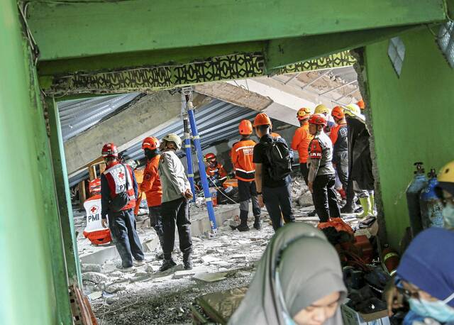 8910209_web1_2025-09-30T033927Z_1802898610_RC202HAAG75S_RTRMADP_3_INDONESIA-DISASTER