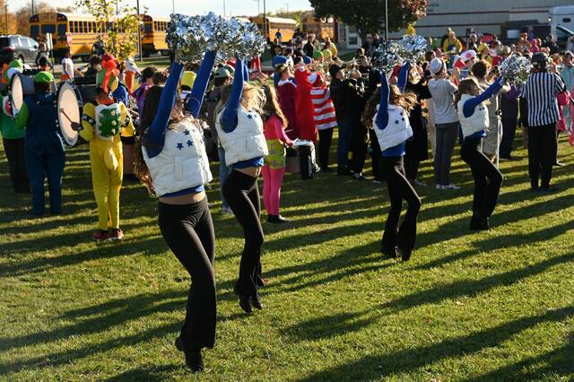 8917654_web1_naj-TrickorTrotCheer-100925