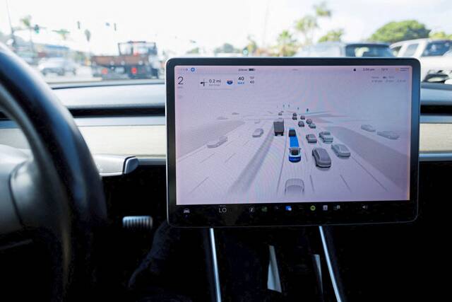 8938504_web1_ptr-Tesla-101025