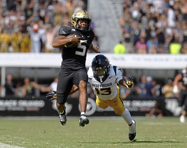 8965559_web1_2025-10-18T204656Z_1745920253_MT1USATODAY27358919_RTRMADP_3_NCAA-FOOTBALL-WEST-VIRGINIA-AT-CENTRAL-FLORIDA
