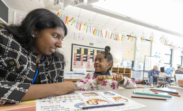 9013673_web1_her-reading101-111325