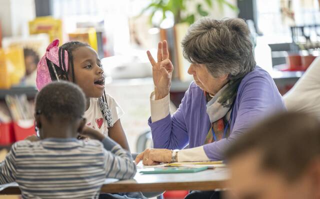 9013673_web1_her-reading103-111325