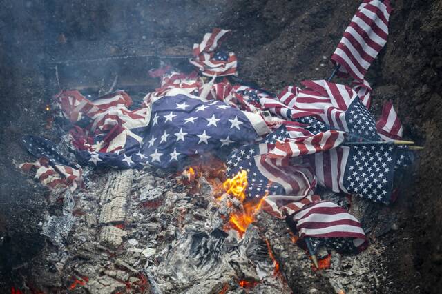 9060932_web1_gtr-lo-FlagBurnCeremony6