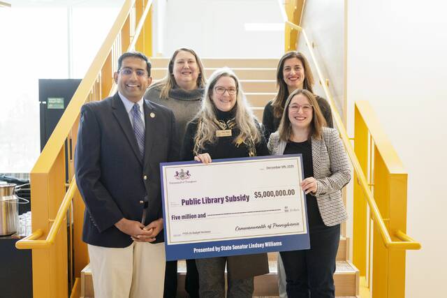 9113525_web1_naj-LibraryBigCheck-012226