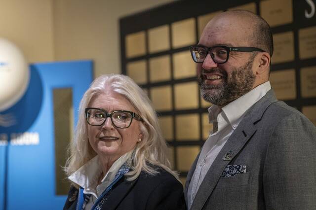 
			
				                                Dana Harris, wife of the late Franco Harris, a member of the History Centers Board of Trustees and the Sports Museums Champions Committee, speaks during an event as her son, Dok Harris, a co-chair of the History Uncorked event committee, listens at the Heinz History Center in Pittsburgh on Tuesday. (Massoud Hossaini | TribLive)

			
		