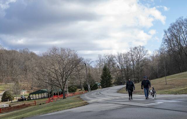 
			
				                                Laurie Means, 68, and Glenn Means, 67, both of Greensburg, walk with their dog Rowan, 5, at Hempfield Park in Greensburg on a partly sunny, windy morning on Monday, Dec. 29, 2025.

			
		