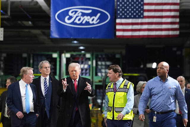 Trump visits Ford plant and defends his tariffs, hoping to counter jitters about the economy