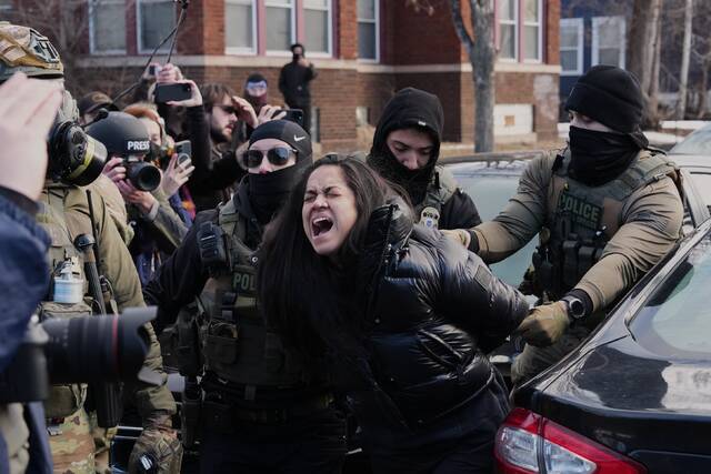 Federal immigration agents filmed dragging woman from her car in Minneapolis