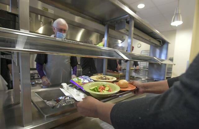 
			
				                                A hot meal is served Dec 9, 2021, at the East End Cooperative Ministry in East Liberty. (Louis B. Ruediger | TribLive)

			
		