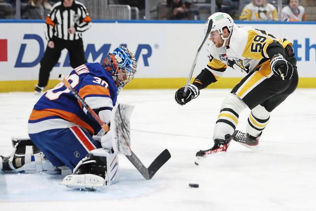 Bryan Rust returns, but Penguins lose to Islanders in OT in division showdown