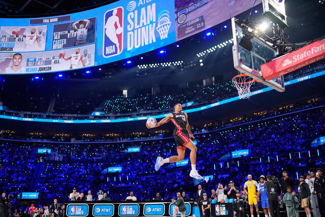 Heat’s Keshad Johnson soars to a slam dunk title, edging Carter Bryant who had a perfect score