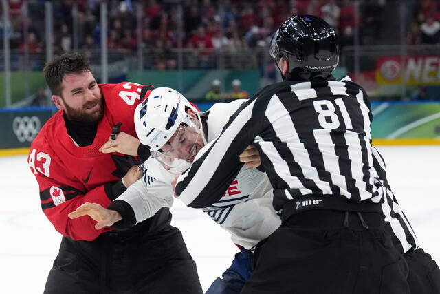 Tom Wilson fights in Canada’s game vs. France at the Olympics