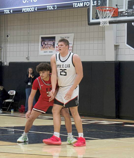 Teammates lend hand to big man Ryan Robbins as Upper St. Clair pulls away from Fox Chapel