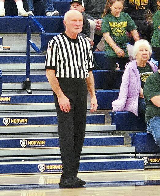 High school basketball referee still running the floor at age 80