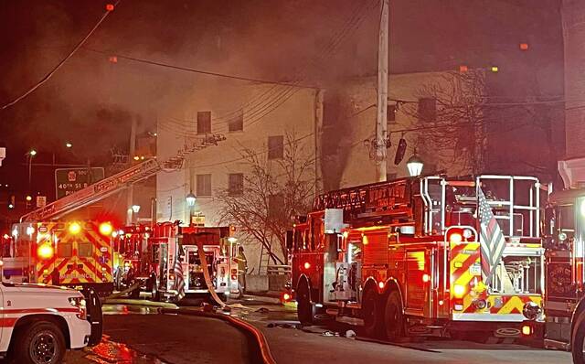 2 firefighters hurt, resident rescued through window in Millvale apartment building fire