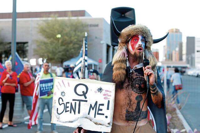 QAnon faithful see validation in the Epstein files