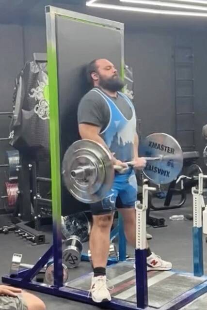 Trafford man wants to curl up, break own world weightlifting record