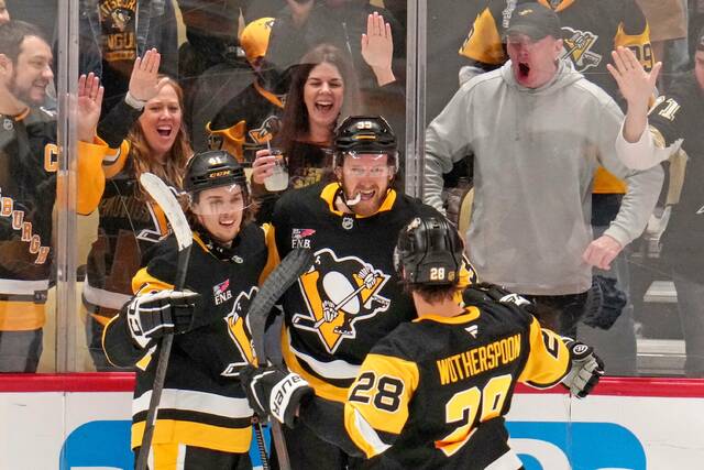 Penguins surge in 3rd to rally, beat Bruins in overtime at home