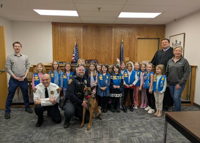 Daisy Troop witnesses official swearing in of McCandless’ K-9, Leroy, while learning about government