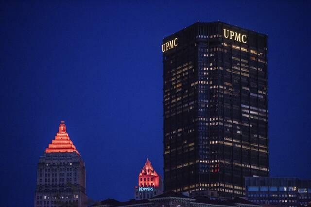 UPMC logo atop Downtown tower turned blue to honor fallen state trooper
