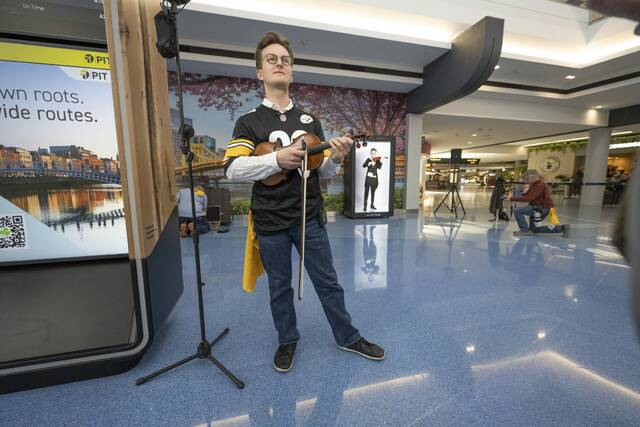 Pittsburgh Symphony Orchestra holograms serenade travelers at Pittsburgh Airport