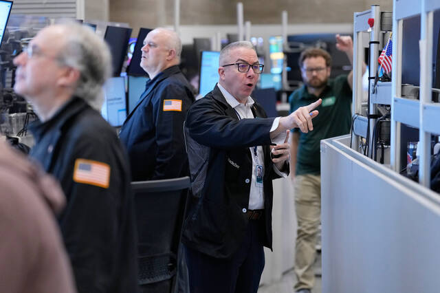 Stocks swing through another shaky day as oil prices keep climbing