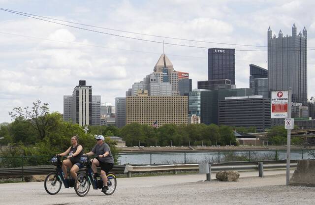 
			
				                                Two bicyclists enjoy the warm weather around Pittsburgh. (Massoud Hossaini | TribLive)

			
		