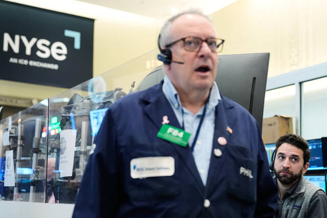 Wall Street rallies to the edge of its all-time high as oil prices ease