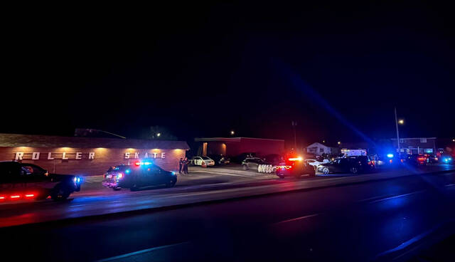 Several police cars responded Wednesday evening to reports of a man shooting a gun into the air at the Neville Roller Dome. (WTAE)
