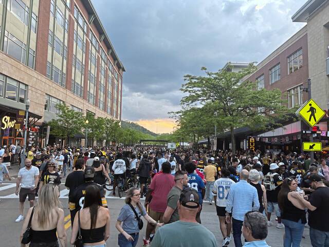 NFL Draft live: Football fans take in the scene while waiting for their teams’ picks