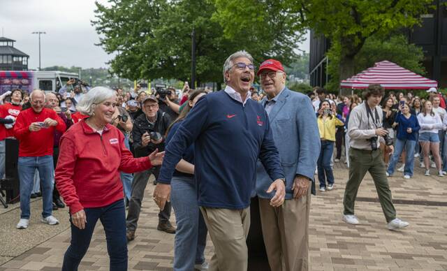 
			
				                                Outgoing Duquesne University President Ken Gormley, center in dark blue, and his wife, Laura, in red, react after being surprised with the naming of the universitys Student Union in their honor during the student Festival on the Buff celebration on Saturday, April 25, 2026. (Massoud Hossaini | TribLive)

			
		