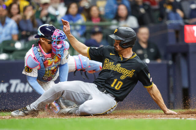 Pirates score 3 runs in 10th for back-to-back victories, clinch series win over Brewers