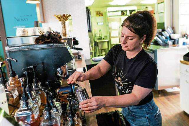 
			
				                                Novo Cafe owner April Zeolla prepares a latte for a drive-thru customer. Zeolla opened Novo Cafe in Arnold in November 2024. (Shane Dunlap | TribLive)

			
		