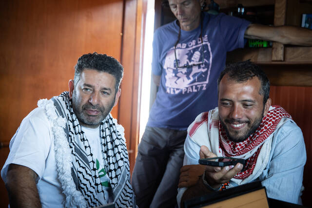 Israeli authorities taking 2 activists from a Gaza-bound flotilla to Israel for questioning