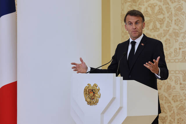 Macron says U.S. and EU are wasting time on tariff threats as Trump fumes over Germany