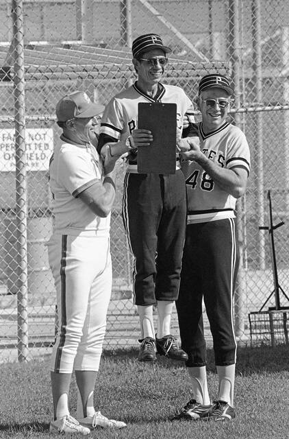 
			
				                                Pittsburgh Pirates pitching coach Harvey Haddix, center, gets a lift from former teammates Vernon Law, left, and Bob Skinner, right, at the Pirate City training complex in Bradenton, Fla., on Feb. 23, 1979 where the Bues opened early camp. All three men played on the 1960 Pirates championship team. (AP)

			
		