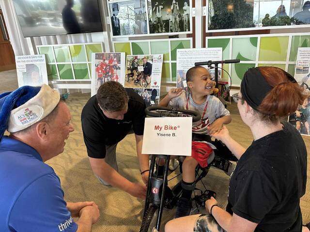 Distribution of another round of adaptive bikes brings more smiles to children and families