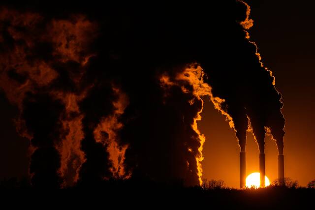 Climate report says world won’t get as hot as feared but will pass warming limit