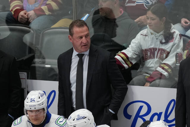 Canucks fire coach Adam Foote after finishing last in NHL in his 1 season